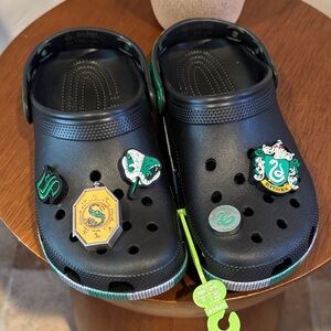 CROCS Black and Green Clogs with Fun Emblems NWOT